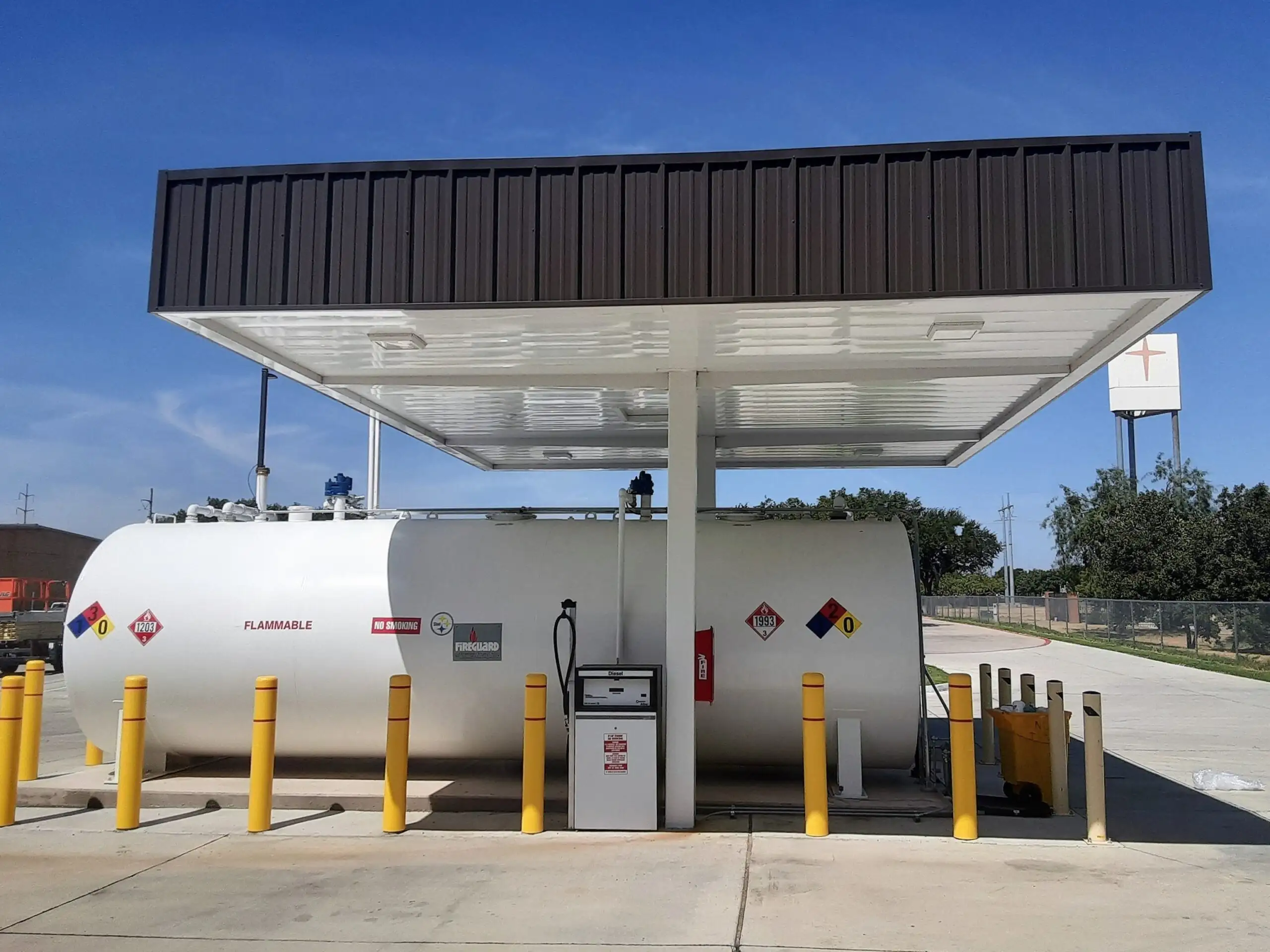 Above ground split fuel tank and dispensers under a steel fueling canopy